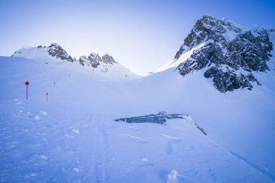 Aerial view of snowcapped mountain against sky