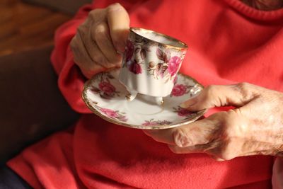 Midsection of woman holding ice cream