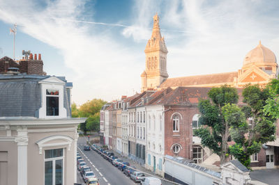 Panoramic view of buildings in city against sky