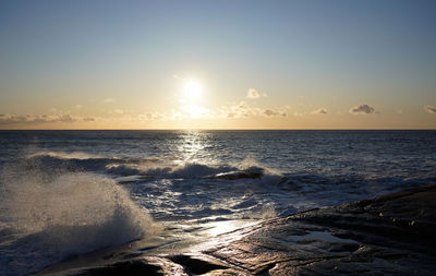 Scenic view of sea against sky during sunset