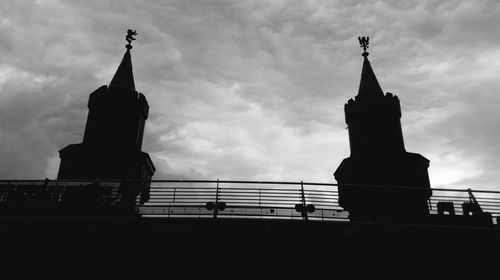 Low angle view of building against cloudy sky