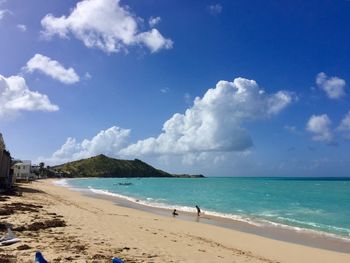 Panoramic view of beach against blue sky