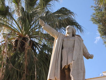 Low angle view of statue against sky