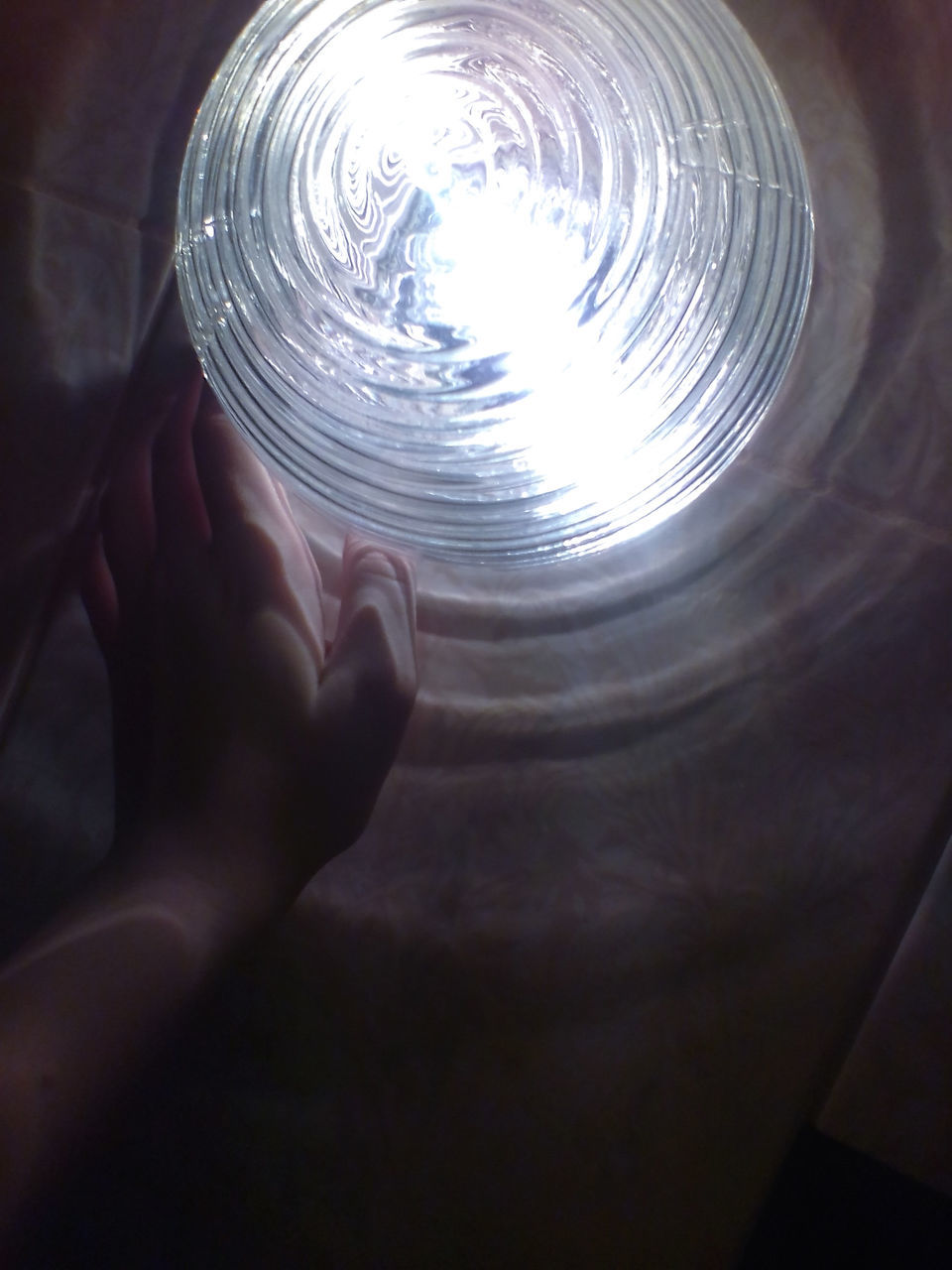 human hand, one person, human body part, real people, human finger, holding, illuminated, indoors, crystal ball, lifestyles, close-up, night, space exploration, futuristic, astronomy, people