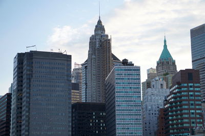 Modern buildings in city against sky