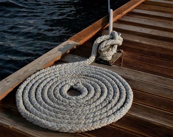 Close-up of rope tied on pier