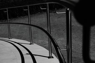 Close-up of railing on footpath