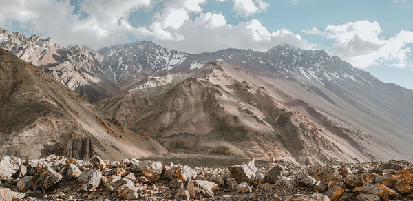 Panoramic view of snowcapped mountains against sky