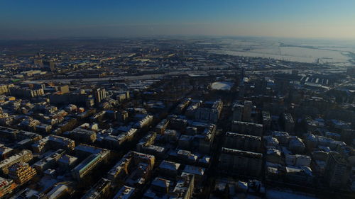 Aerial view of illuminated cityscape against sky