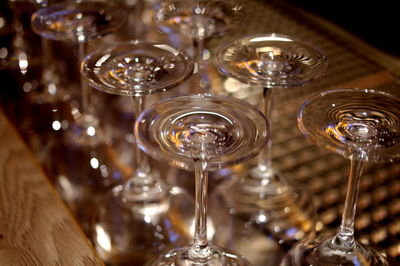 Close-up of wine glasses on table