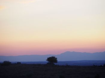 Scenic view of landscape against sky during sunset