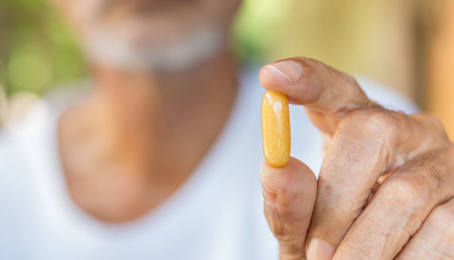 Close-up of hand holding ice cream