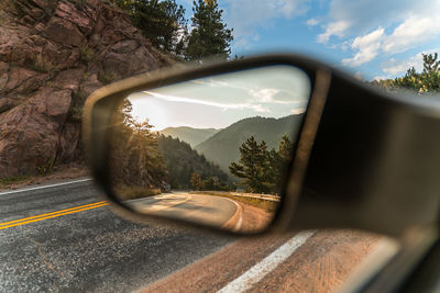 Reflection of car on side-view mirror