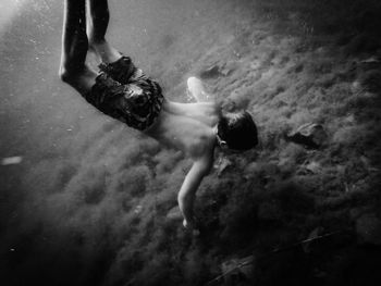 Boy diving in lake