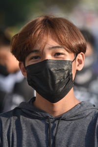 Close-up portrait of boy wearing mask