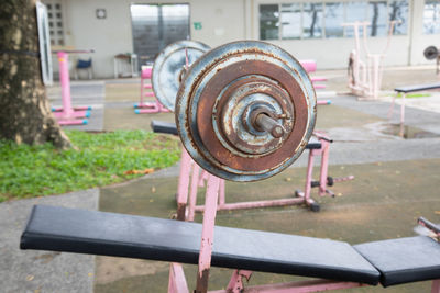 Close-up of empty bench in park