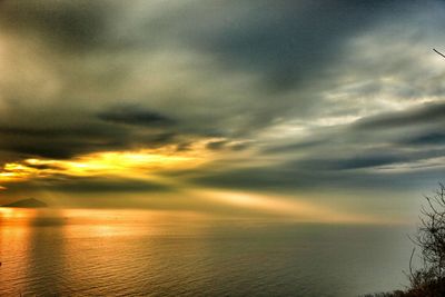 Scenic view of sea against cloudy sky