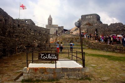 People at observation point against sky