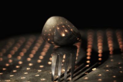 Close-up of illuminated lighting equipment on table