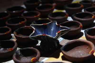 Artistic homemade clay oil lamps or karthikai deepam are ready for diwali and karthikai festivals