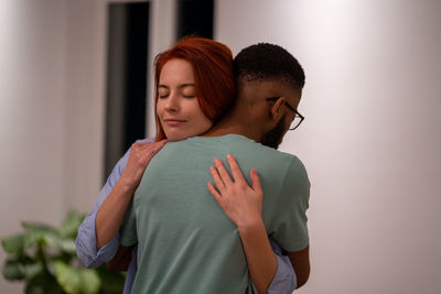 Black guy and girl hugging moment of strong feelings of love and friendship. loving couple