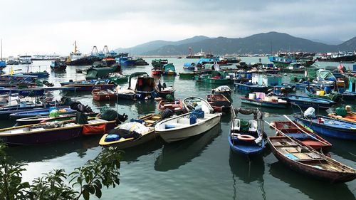 High angle view of boats moored on mountain against sky