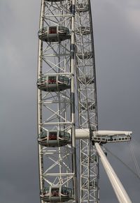 Low angle view of ferris wheel against sky