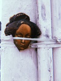 Close-up portrait of man against wall