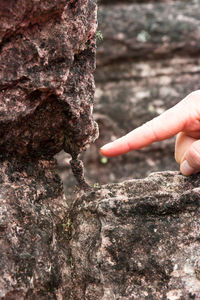 Close-up of hand holding rock