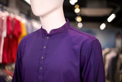 Close-up of purple kurta on mannequin in store