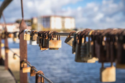 Close-up of padlocks on railing