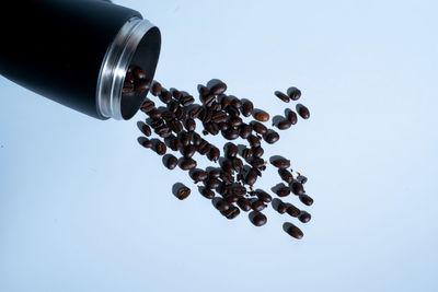 Close-up of coffee beans against white background