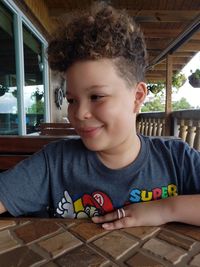 Portrait of boy playing with table