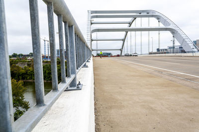 Empty road along bridge