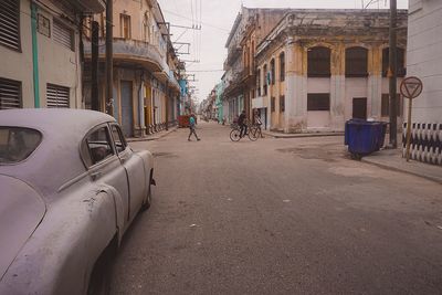 Man in car against sky