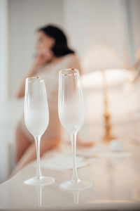 Portrait of woman drinking glass on table