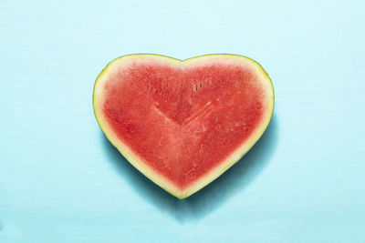 Directly above shot of heart shape against blue background