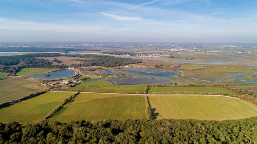 Aerial view of agricultural field against sky