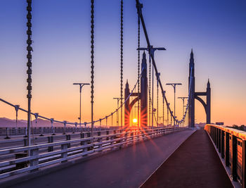 Bridge against sky at sunset