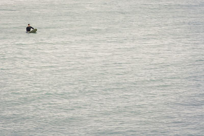 High angle view of man surfing in sea