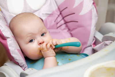 Close-up of cute baby boy sleeping on bed at home