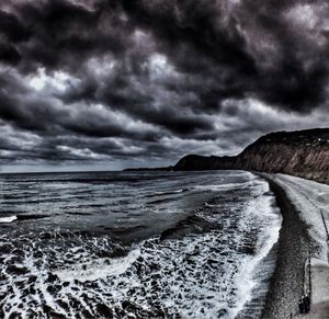 Scenic view of sea against cloudy sky