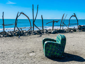 Scenic view of sea shore against blue sky