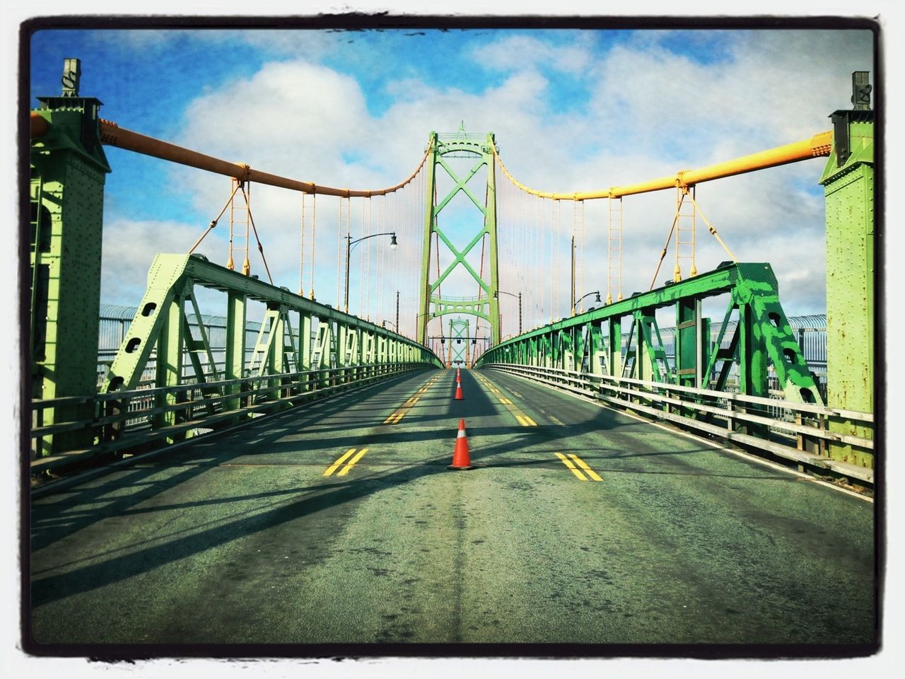 sky, the way forward, transfer print, architecture, built structure, diminishing perspective, cloud - sky, transportation, auto post production filter, road, vanishing point, road marking, cloud, connection, railing, bridge - man made structure, street light, building exterior, cloudy, empty