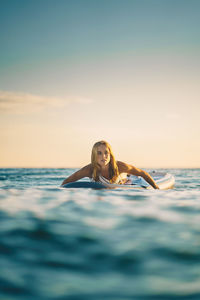 Portrait of woman swimming in sea