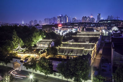 High angle view of illuminated buildings at night