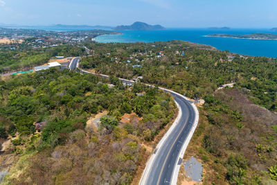 High angle view of road by sea against sky