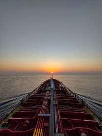 Scenic view of sea against clear sky during sunset