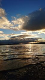 Scenic view of beach against sky during sunset