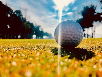 Close-up of golf ball on field